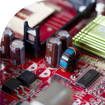 A close up of various electronics components with custom label solutions on a circuit board.