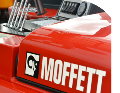 A customized red truck with the word Moffett on it.