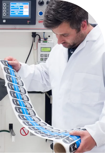 A man in a lab coat examining medical labels.