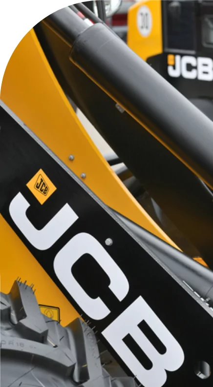 A high quality close up of a yellow and black JCB machine with custom label solutions.