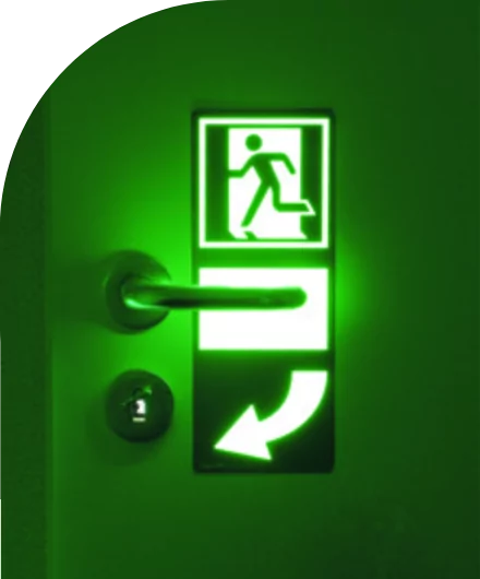 A custom green exit sign with an arrow pointing to the door.